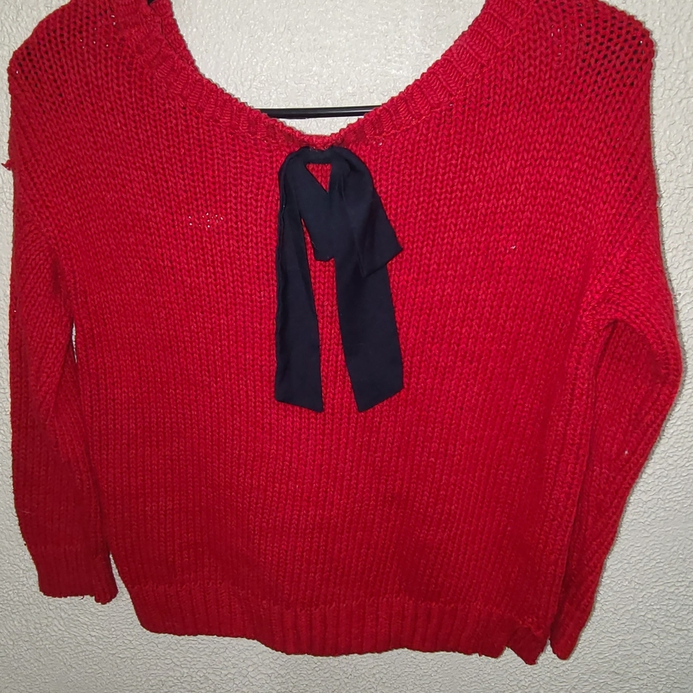 Red knit sweater with bow on back